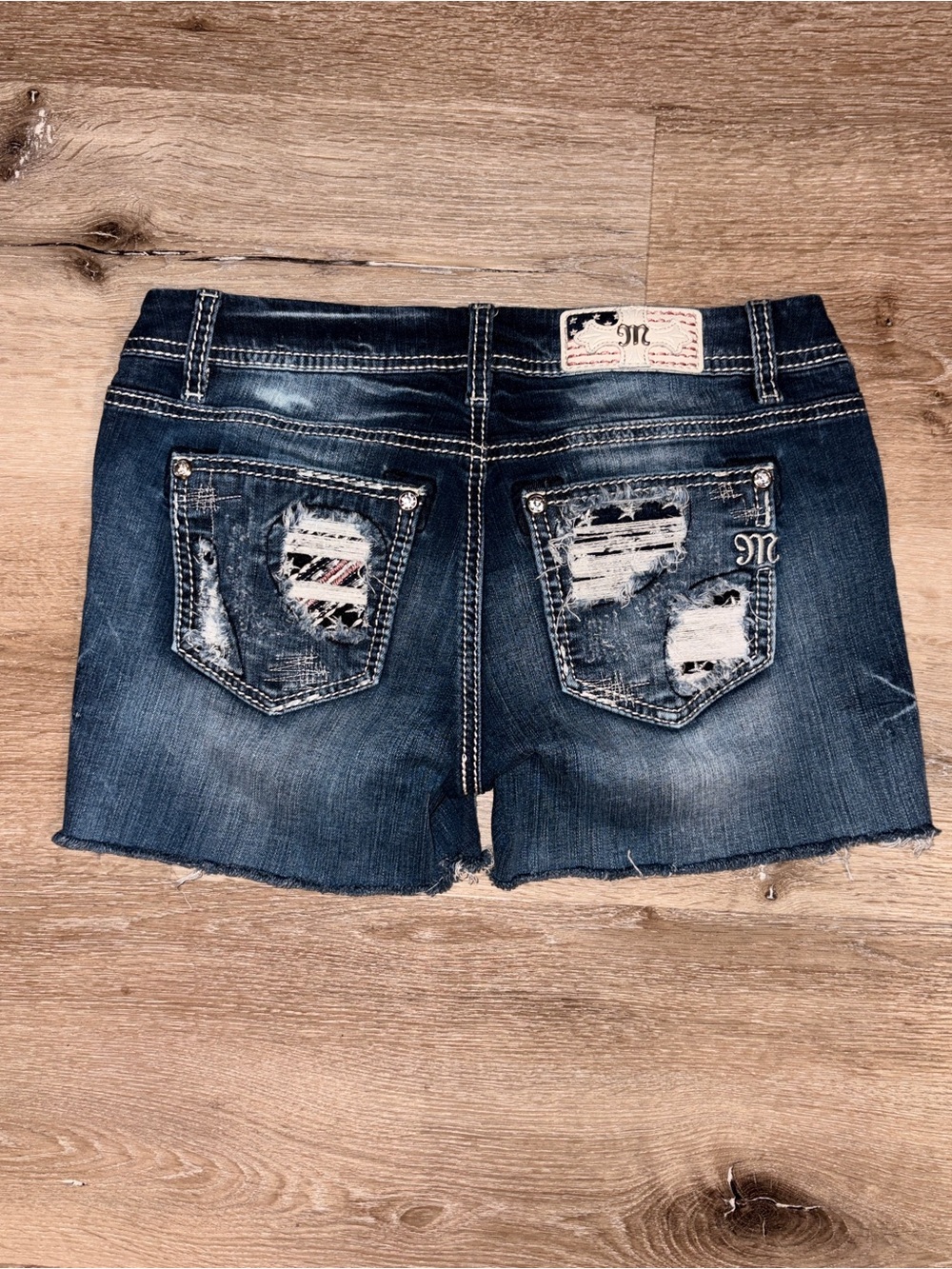 Miss Me Indigo Distressed Denim Cutoff Shorts with Embroidered Pockets